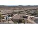 Aerial shot of home featuring tile roof, backyard pool and privacy fence at 19517 W Huron Ln, Buckeye, AZ 85326