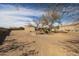 Vast desert backyard ready for customization and landscaping opportunities at 19517 W Huron Ln, Buckeye, AZ 85326