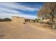 Wide shot of the desert backyard highlighting the exterior and space for customization at 19517 W Huron Ln, Buckeye, AZ 85326