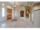 Foyer with inlaid tile design, custom lighting, and view to the surrounding rooms at 19517 W Huron Ln, Buckeye, AZ 85326