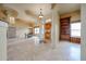 Open foyer area with elegant marble floors and an adjoining dining area at 19517 W Huron Ln, Buckeye, AZ 85326