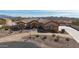 Stunning home featuring desert landscaping, charming circular driveway and beautiful mountain views at 19517 W Huron Ln, Buckeye, AZ 85326