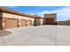 Extensive garage space featuring a three-car garage connected to the home plus a detached garage at 19517 W Huron Ln, Buckeye, AZ 85326