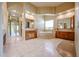 Spa-like main bathroom with double sinks, a soaking tub, and luxurious finishes at 19517 W Huron Ln, Buckeye, AZ 85326