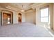 Large main bedroom with a tray ceiling and neutral color palette at 19517 W Huron Ln, Buckeye, AZ 85326