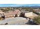 A rear exterior shot of the home showcasing garages and paved driveway at 19517 W Huron Ln, Buckeye, AZ 85326