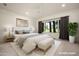 Bright bedroom with large window, offering a view of the backyard at 34 Biltmore Est, Phoenix, AZ 85016