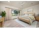 Spacious bedroom with large window and natural light, virtually staged at 34 Biltmore Est, Phoenix, AZ 85016