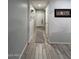 Bright and spacious hallway with wood-look tile flooring at 532 W Tenia Trl, San Tan Valley, AZ 85140