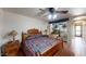 Bedroom with wooden bed frame and access to garden at 1007 N Revere --, Mesa, AZ 85201