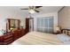 Bedroom with wood dresser, tiled floors and an ensuite bathroom at 1007 N Revere --, Mesa, AZ 85201