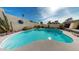 Inviting kidney-shaped pool with surrounding landscaping at 1007 N Revere --, Mesa, AZ 85201