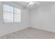 Well-lit bedroom with window and ceiling fan at 2067 W Periwinkle Way, Chandler, AZ 85248