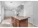 Kitchen island with granite countertop and wood cabinets at 2067 W Periwinkle Way, Chandler, AZ 85248