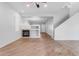 Spacious living room, featuring a fireplace and wood-look floors at 2067 W Periwinkle Way, Chandler, AZ 85248