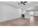 Living room with fireplace and wood-look flooring at 2067 W Periwinkle Way, Chandler, AZ 85248