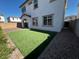 Artificial turf backyard with gravel and some landscaping at 2200 N Iowa St, Chandler, AZ 85225