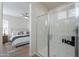 Beautiful bathroom featuring a glass-enclosed shower with subway tile and a glimpse into the bedroom at 2200 N Iowa St, Chandler, AZ 85225