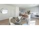 Dining area with a modern round table, chairs, and open access to the kitchen, creating a welcoming space for entertaining at 2200 N Iowa St, Chandler, AZ 85225