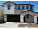 Two-story home with modern design, attached garage, and desert landscaping at 2200 N Iowa St, Chandler, AZ 85225