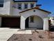 Front entrance of a two-story house with arched entryway at 2200 N Iowa St, Chandler, AZ 85225