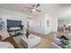 Open-concept living room showcasing neutral furniture, a large TV, and seamless flow into the kitchen at 2200 N Iowa St, Chandler, AZ 85225