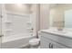 A clean bathroom with a tub and shower combo, toilet, and a white vanity with countertop at 5656 N 205Th Ln, Buckeye, AZ 85396