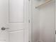An open closet featuring a door with simple modern hardware and one wood rod for hanging clothes at 5656 N 205Th Ln, Buckeye, AZ 85396
