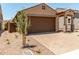 Lovely single-story home with a two-car garage, covered entry, and easy-care desert landscaping at 5656 N 205Th Ln, Buckeye, AZ 85396