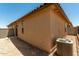 A shot of the exterior of the home featuring a new AC unit, a window and tile roof at 5656 N 205Th Ln, Buckeye, AZ 85396