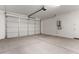 A spacious two car garage with an automatic door and a water heater at 5656 N 205Th Ln, Buckeye, AZ 85396