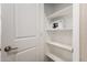 A walk-in pantry is equipped with shelving for organized storage space at 5656 N 205Th Ln, Buckeye, AZ 85396