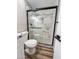 Renovated bathroom with a marble shower and new toilet at 7316 W Carol Ave, Peoria, AZ 85345