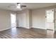 Bright bedroom with wood-look floors and access to backyard at 7316 W Carol Ave, Peoria, AZ 85345