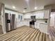 Updated kitchen featuring stainless steel appliances and marble counters at 7316 W Carol Ave, Peoria, AZ 85345