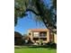 Two-story building with balconies, surrounded by lush landscaping at 8260 E Arabian Trl # 151, Scottsdale, AZ 85258