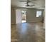 A bright living room with tile flooring and sliding glass doors leading to an outdoor patio at 8260 E Arabian Trl # 151, Scottsdale, AZ 85258