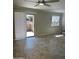 A bright living room with tile flooring and sliding glass doors leading to an outdoor patio at 8260 E Arabian Trl # 151, Scottsdale, AZ 85258