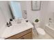 Clean bathroom with single vanity and bathtub at 12548 W Parkway Ln, Avondale, AZ 85323