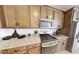 Well-equipped kitchen showcasing cabinetry and gas range at 12548 W Parkway Ln, Avondale, AZ 85323