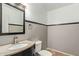 Clean bathroom with granite vanity and dark cabinets at 23559 W Wayland Dr, Buckeye, AZ 85326