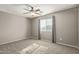 Simple bedroom with ceiling fan and carpet flooring at 23559 W Wayland Dr, Buckeye, AZ 85326