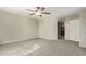 Spacious bedroom with ceiling fan and large closet at 23559 W Wayland Dr, Buckeye, AZ 85326