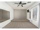 Spacious bedroom with wall-to-wall carpet and mirrors at 23559 W Wayland Dr, Buckeye, AZ 85326