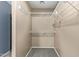 Large walk-in closet with double hanging rods at 23559 W Wayland Dr, Buckeye, AZ 85326