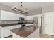 Modern kitchen with stainless steel appliances and an island at 23559 W Wayland Dr, Buckeye, AZ 85326