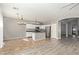 Modern kitchen with island and chandelier lighting at 23559 W Wayland Dr, Buckeye, AZ 85326