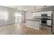 Modern kitchen featuring stainless steel appliances and island at 23559 W Wayland Dr, Buckeye, AZ 85326