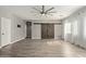 Living room with hardwood floors and barn doors at 23559 W Wayland Dr, Buckeye, AZ 85326