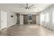 Living room with hardwood floors and barn doors at 23559 W Wayland Dr, Buckeye, AZ 85326